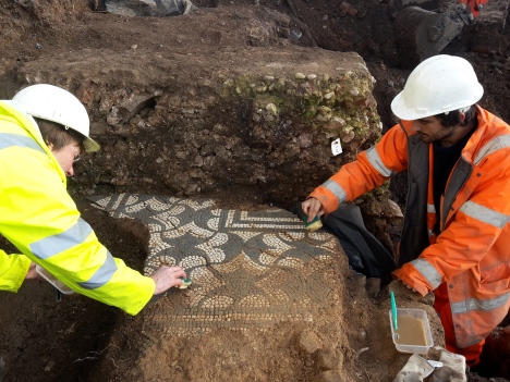 Archaeologists excavate the high-status mosaic floor.